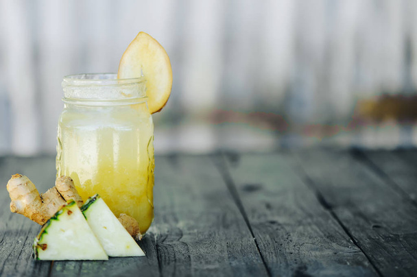 pineapple smoothie on wood background - Foto, Bild