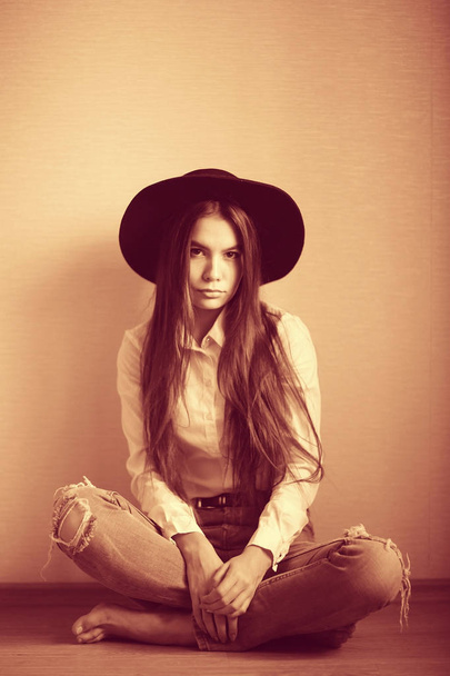 teenage girl in black hat - Фото, изображение