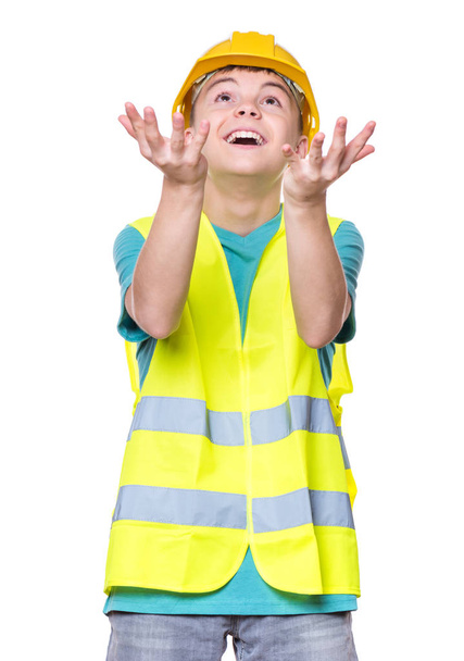 Boy wearing yellow hard hat - Fotoğraf, Görsel