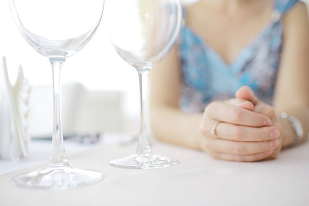 two wineglasses on table - Фото, изображение