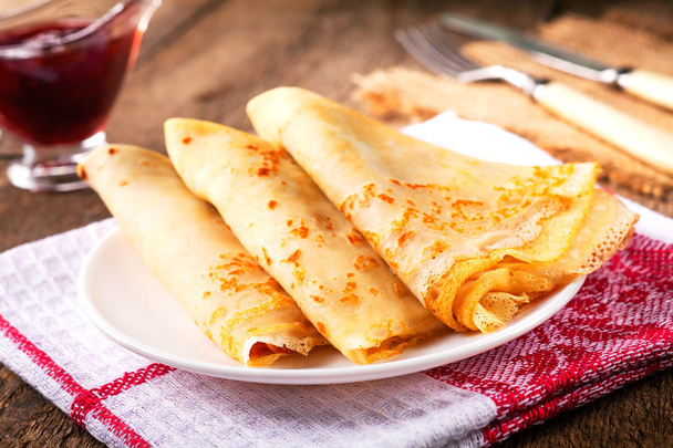 Homemade wheat crepes or pancakes with strawberry jam or marmala - Photo, Image