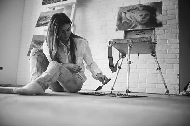young beautiful female artist at work in the workshop, creativity and inspiration concept - Фото, зображення
