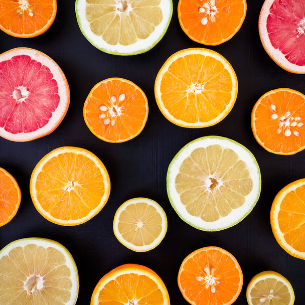 citrus fruits on dark background - Фото, зображення