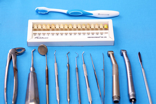 surgical instruments and tools including scalpels, forceps and tweezers arranged on a table for a surgery - Photo, Image