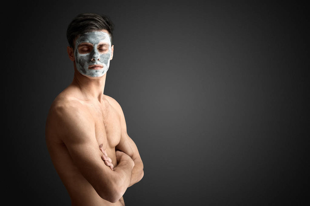 man with cleaning clay facial mask - Foto, afbeelding