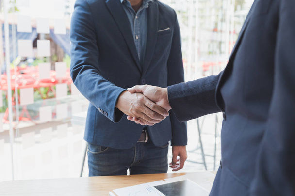 businessman handshaking after meeting in office - teamwork, coop - Фото, изображение