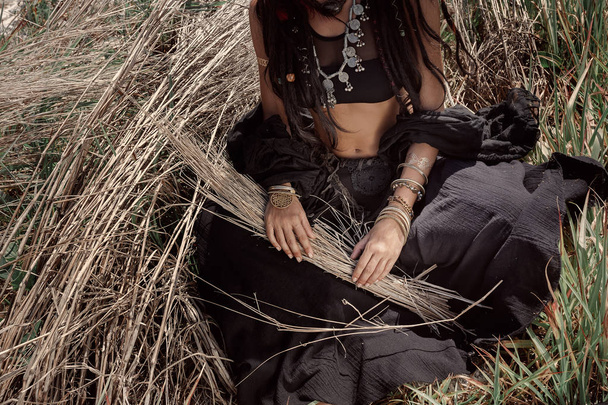 Beautiful young boho woman on grass. Close up - Фото, изображение