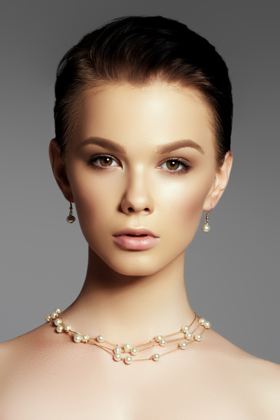 The beautiful woman in expensive pendant close-up. Beautiful you - Fotografie, Obrázek