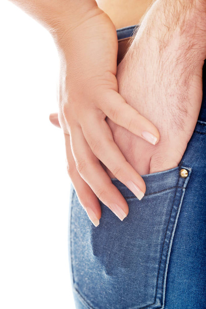 Male hand in womans jeans pocket. - Фото, изображение