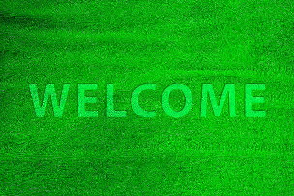 Welcome word cotton carpet colorful in green. - Photo, Image