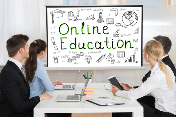 Businesspeople Looking At Online Education  - 写真・画像