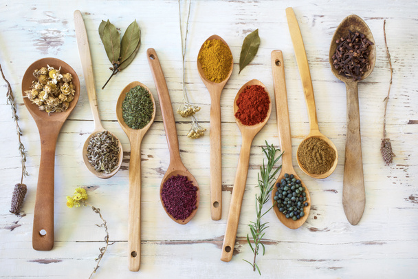 Spices and herbs on wooden background - Fotografie, Obrázek