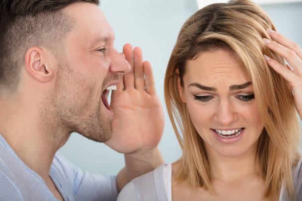 Man Screaming In Wife Ear - Фото, изображение