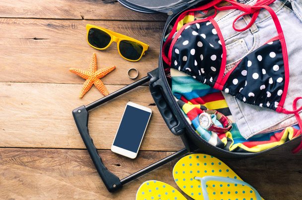 Clothing traveler's , wallet, smart phone devices, on a wooden f - Fotó, kép