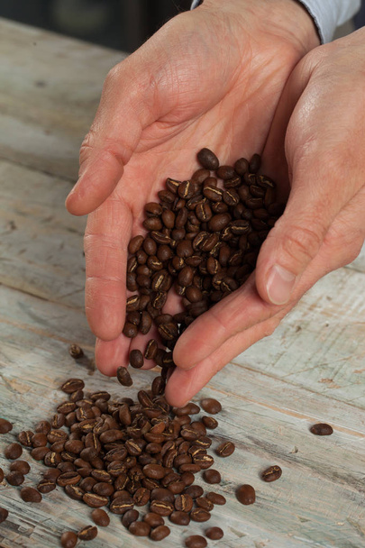 Coffee beans in the hands - Photo, Image