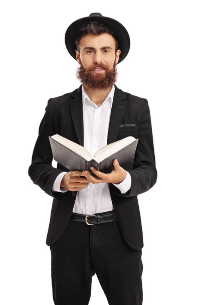 Religious man holding a holy book - Foto, Imagem