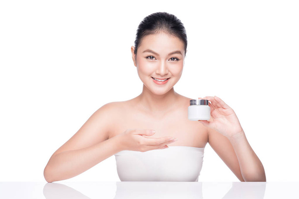 woman holding moisturizing cream box - Photo, Image