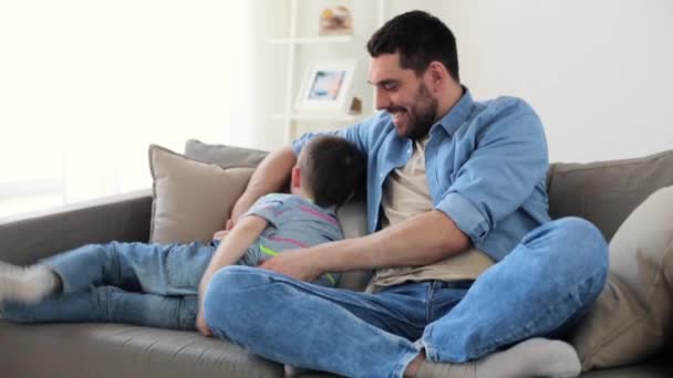 father with son playing and having fun at home - Video