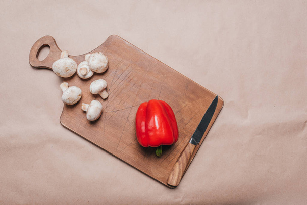 bell pepper and mushrooms on wooden board - Photo, Image