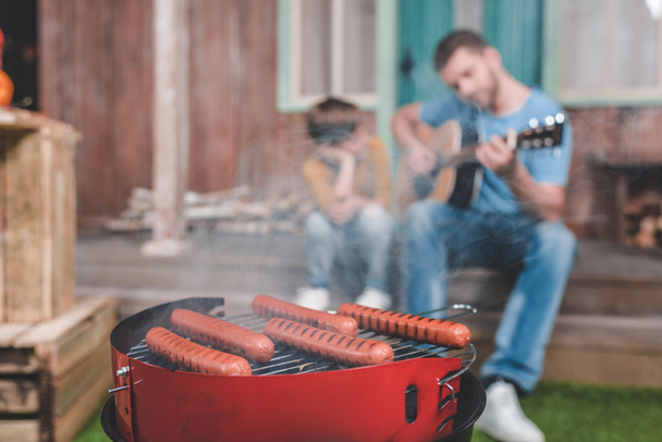 hot dog sausages on grill - Φωτογραφία, εικόνα