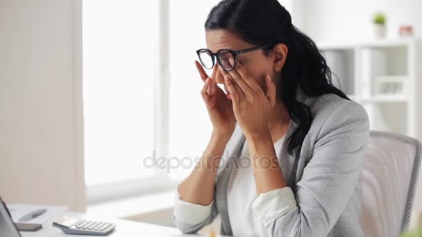 tired businesswoman in glasses at office - Video, Çekim