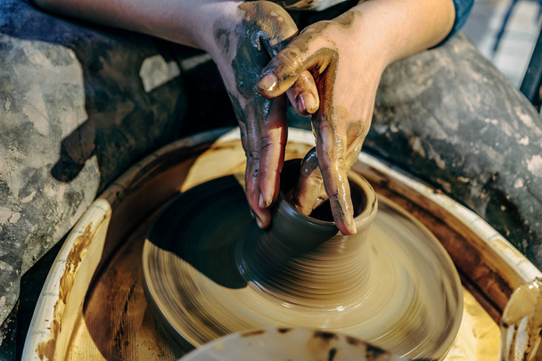 Clay potter working with clay wheel - Photo, Image