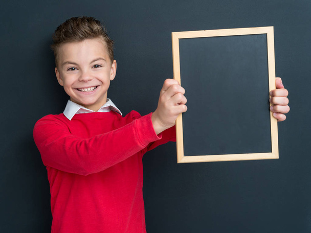 Teen boy with small blackboard - Foto, Imagen