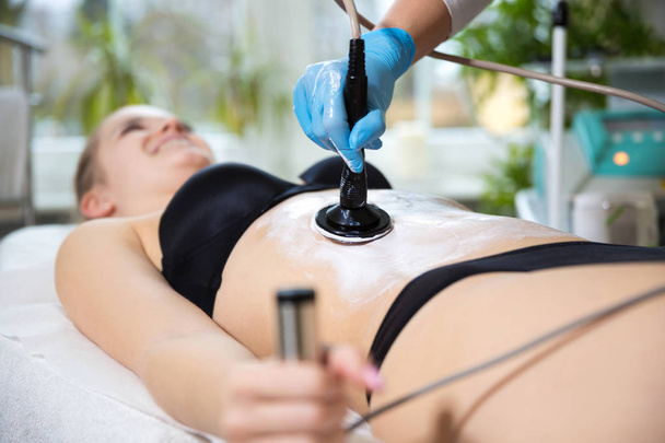 Woman at beautician's getting thermaslim lavatron therapy  - Photo, image