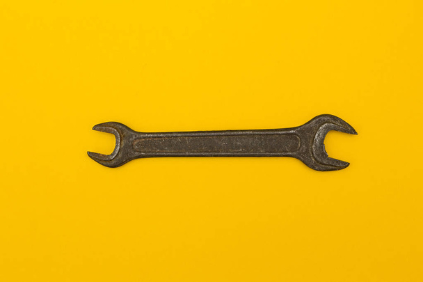 Spanner on a yellow background.  - Photo, image