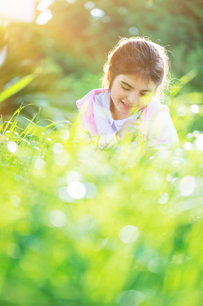 Little girl on the spring field - Фото, зображення