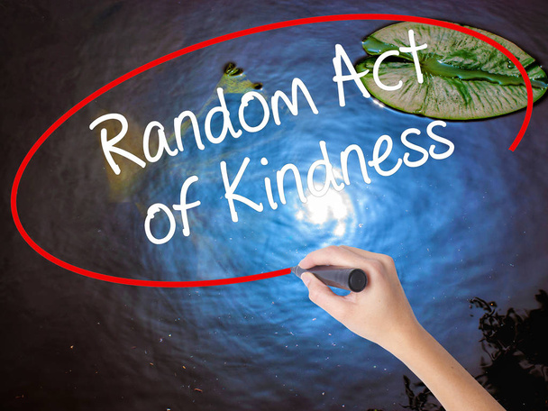 Woman Hand Writing Random Act of Kindness with marker over trans - Photo, Image