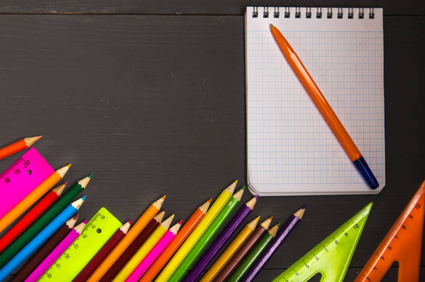 School supplies (pencil, pen, ruler, triangle) on blackboard bac - Foto, Imagem