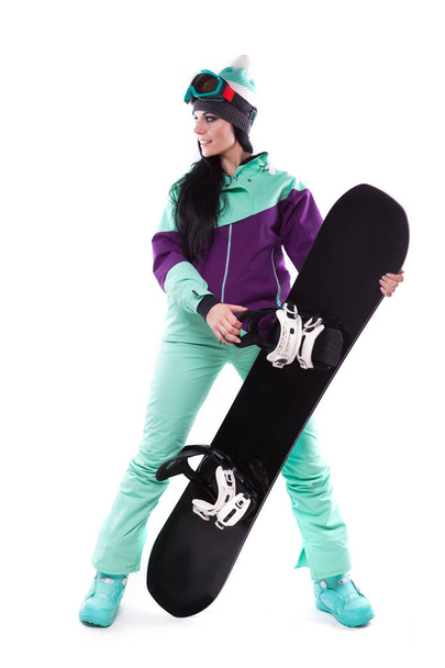 femme en costume de ski violet avec snowboard
 - Photo, image