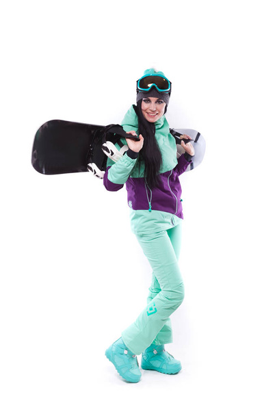 woman in purple ski costume with snowboard - Foto, Imagem
