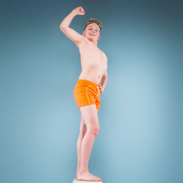 funny boy in orange swimming suit - Valokuva, kuva