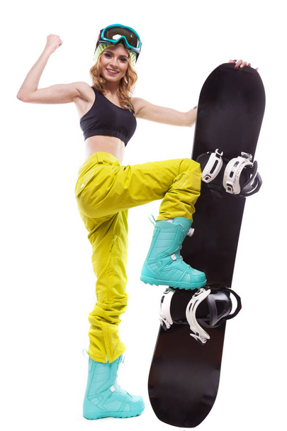 симпатичная спортивная девушка со сноубордом
 - Фото, изображение