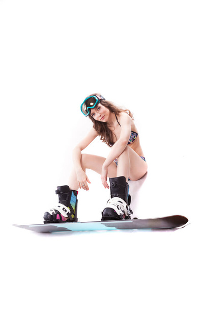 pretty sexy woman in bikini on snowboard - Valokuva, kuva