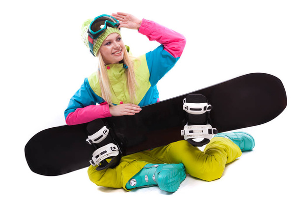 beautiful young woman with snowboard - Photo, Image
