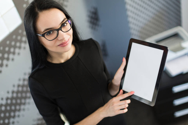 Business lady in black dress with tablet - Photo, Image