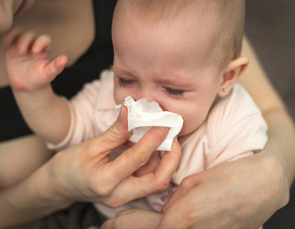 A small, sick, crying child - Photo, Image
