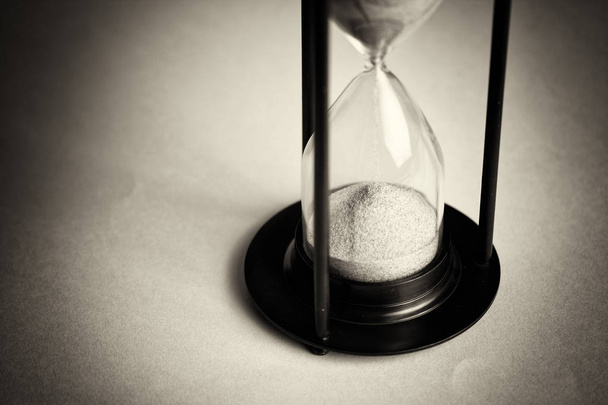 Large black hourglass against a blue background - Photo, Image
