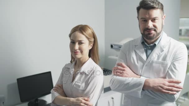 Portrait of cheerful doctors posing together - Video, Çekim