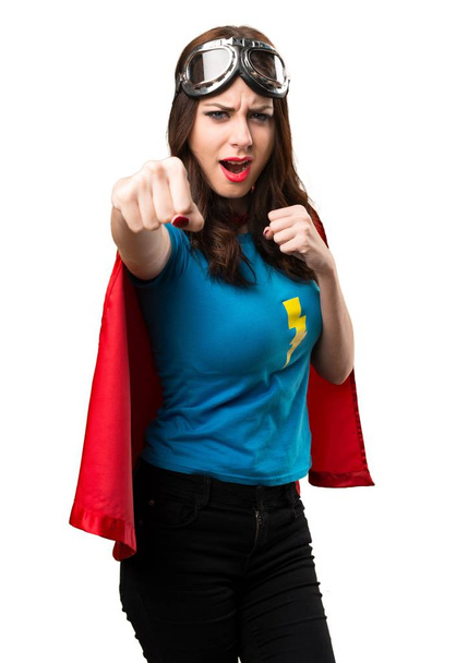 Досить супергеройська дівчина дає удар
 - Фото, зображення