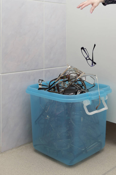 Old glasses in the garbage container - Photo, Image