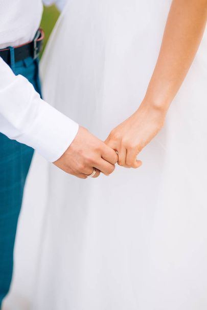 The newlyweds hold hands. Couple holding hands. Wedding in Monte - Photo, Image
