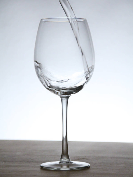 Still of a glass with background light. - Photo, image