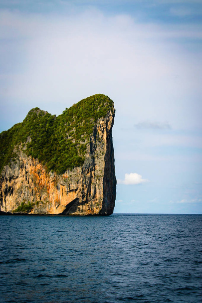 Great and large rocks in the ocean. Small islands with green for - Photo, Image