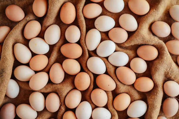 Close up of  eggs in a basket. top view of eggs in bowl. Brown e - Photo, Image