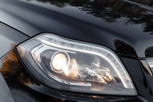 headlights of black car - Фото, изображение