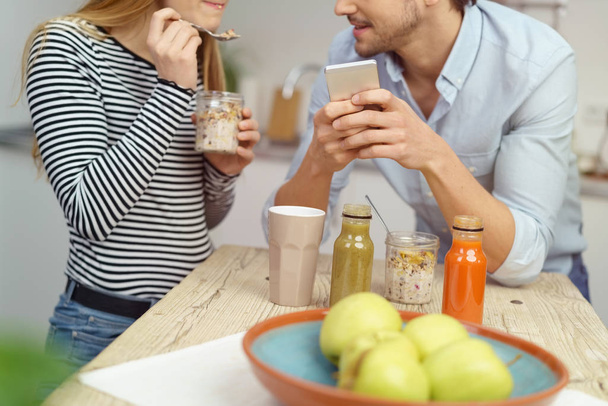 Young couple enjoying a healthy snack - Фото, изображение